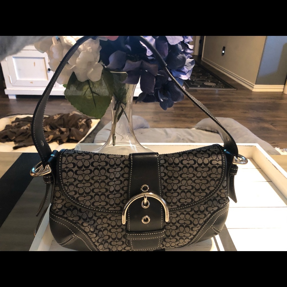 Black and gray canvas Coach purse.